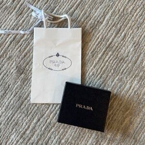 Prada wallet box, empty, and gift with ribbon